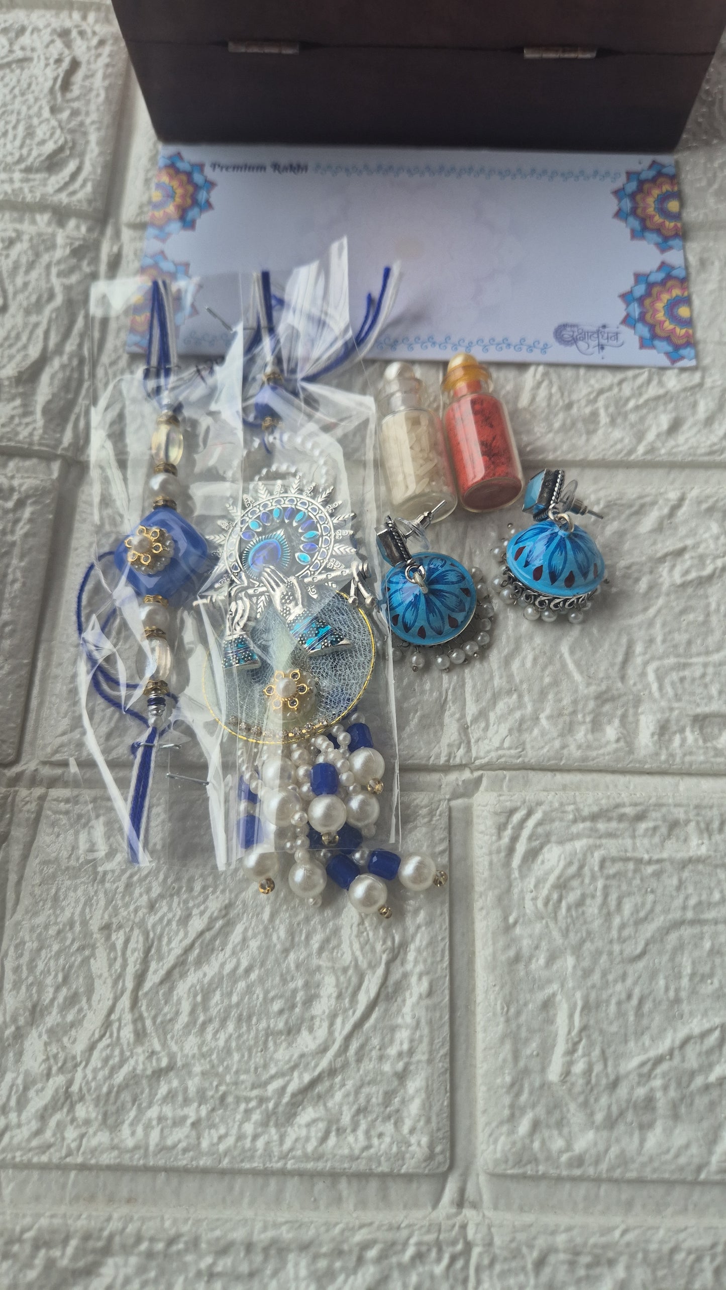 Krishna rakhi +jhumka+roli n chawal